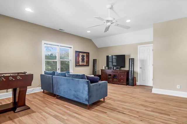 living area featuring light wood-type flooring, lofted ceiling, baseboards, and recessed lighting