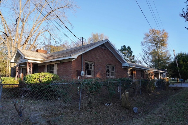 150 M L King Blvd, Saint Stephen, SC 29479 - view of side of home with brick siding and a chimney