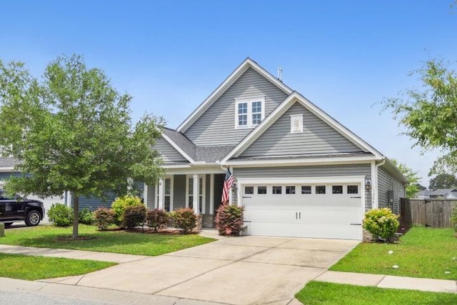 view of front facade featuring a garage and a front lawn