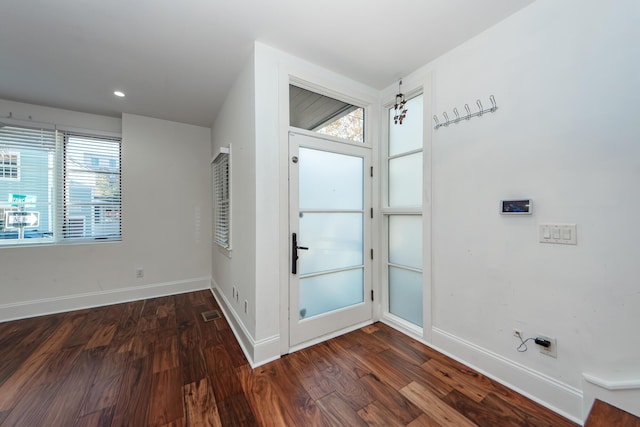 entrance foyer featuring dark hardwood / wood-style flooring