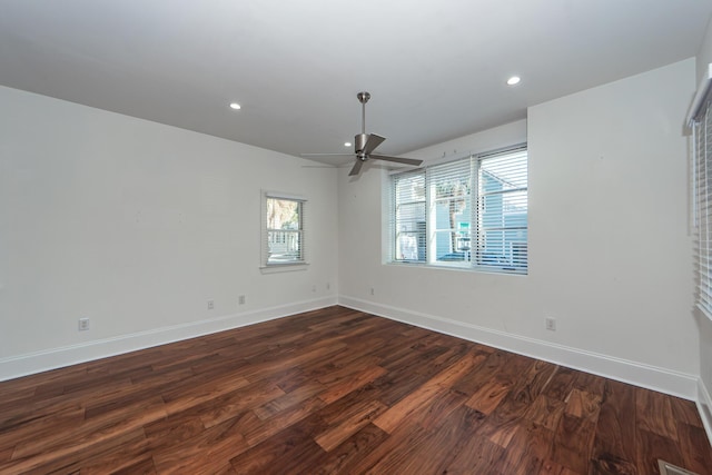 unfurnished room featuring dark hardwood / wood-style floors and ceiling fan