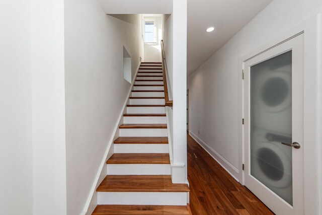 stairs with hardwood / wood-style floors