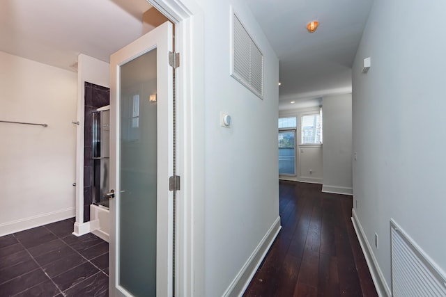 hall with dark wood-type flooring