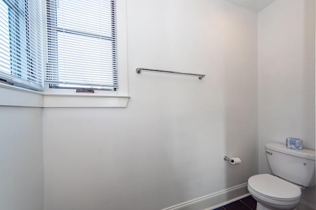 bathroom with tile patterned flooring and toilet