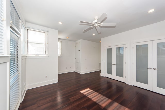 spare room featuring french doors, dark hardwood / wood-style flooring, and ceiling fan