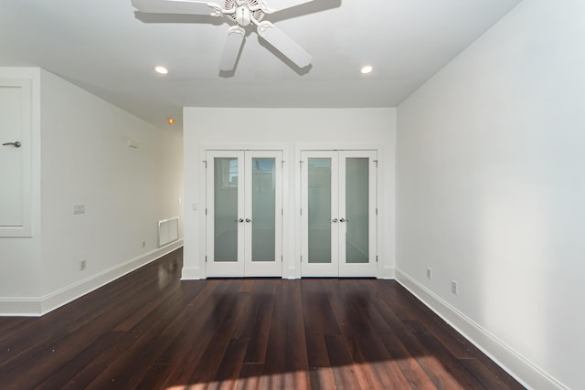 unfurnished room with ceiling fan, dark hardwood / wood-style flooring, and french doors