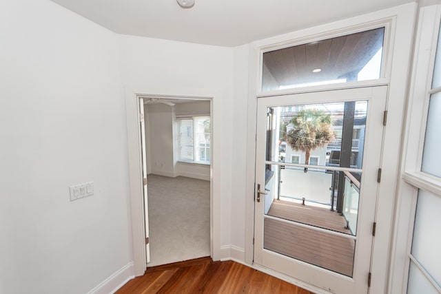 doorway with hardwood / wood-style floors