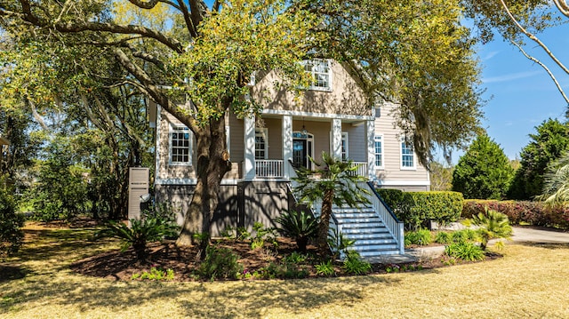4233 Haulover Dr, Johns Island, SC 29455 - view of front facade with stairs and a porch