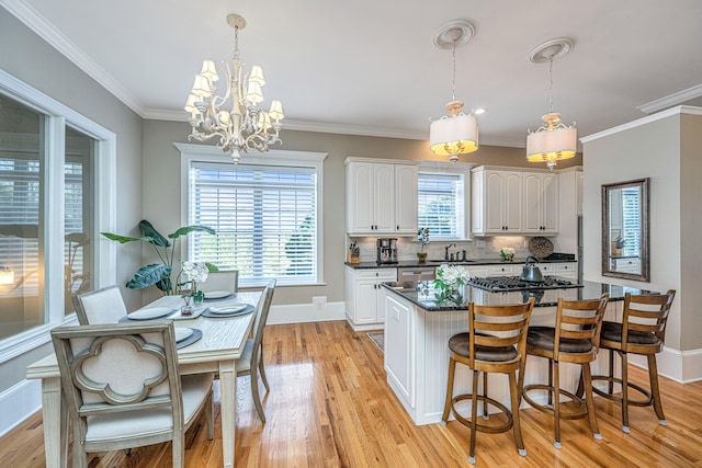 kitchen featuring a wealth of natural light, light wood-type flooring, and white cabinets