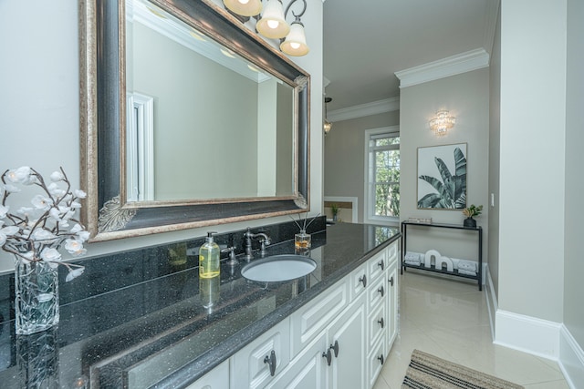 bathroom with vanity, ornamental molding, and tile patterned flooring