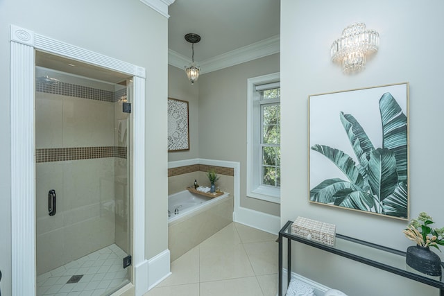 4233 Haulover Dr, Johns Island, SC 29455 - bathroom featuring a shower stall, ornamental molding, a chandelier, a bath, and tile patterned flooring