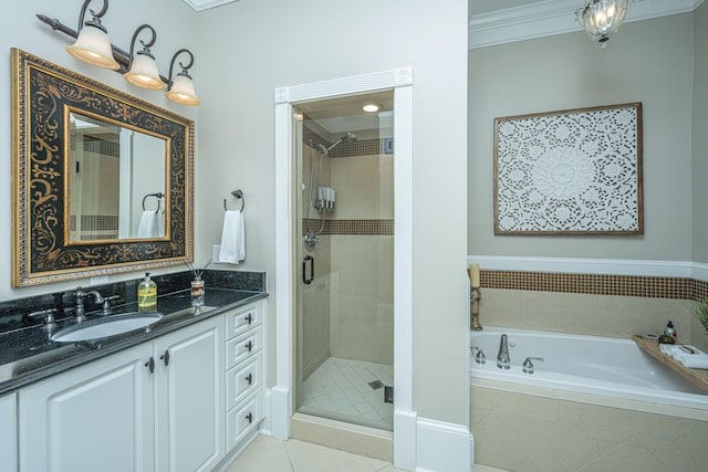 bathroom featuring vanity, separate shower and tub, ornamental molding, and tile patterned floors