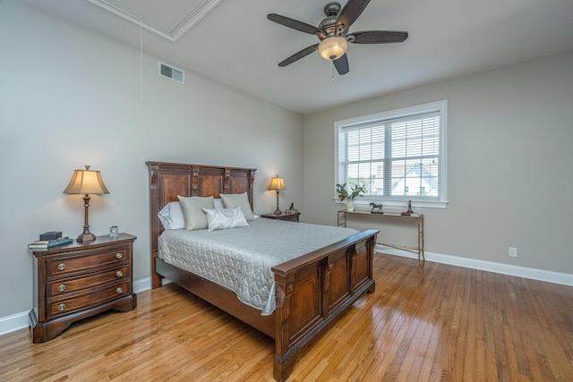 bedroom with light hardwood / wood-style flooring and ceiling fan