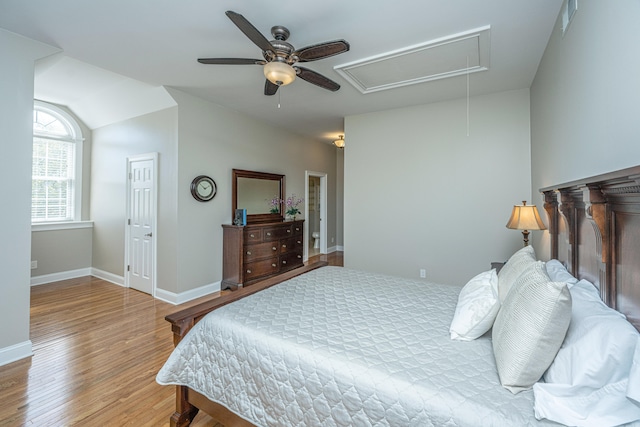 bedroom featuring lofted ceiling, hardwood / wood-style floors, and ceiling fan