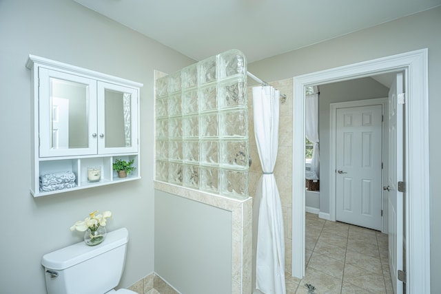 4233 Haulover Dr, Johns Island, SC 29455 - bathroom featuring tiled shower, toilet, and tile patterned floors