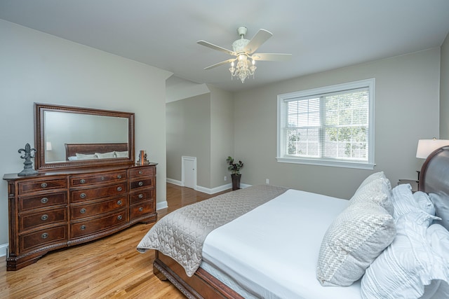 bedroom featuring wood-type flooring and ceiling fan