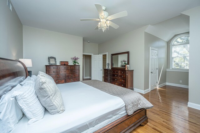 bedroom with hardwood / wood-style floors and ceiling fan