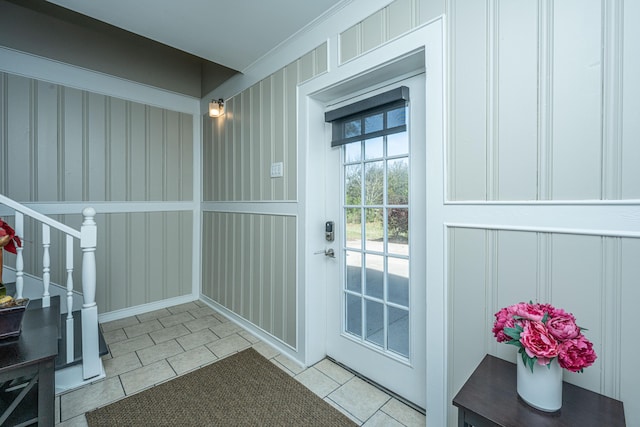 4233 Haulover Dr, Johns Island, SC 29455 - entryway with light tile patterned flooring, a decorative wall, and stairway