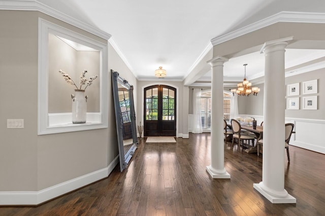 241 Clubside Dr, Lexington, SC 29072 - entryway with decorative columns, a chandelier, dark wood-type flooring, and ornamental molding
