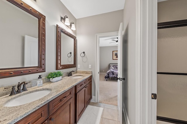 241 Clubside Dr, Lexington, SC 29072 - ensuite bathroom featuring double vanity, tile patterned floors, and baseboards