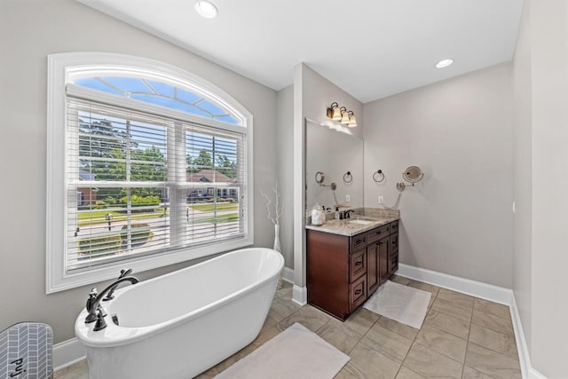 241 Clubside Dr, Lexington, SC 29072 - full bath with a soaking tub, vanity, baseboards, and recessed lighting