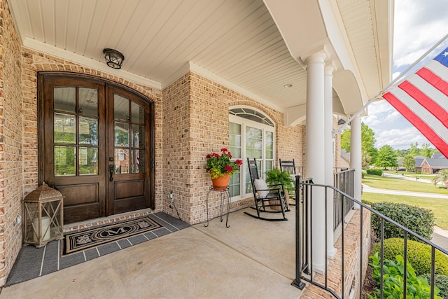 241 Clubside Dr, Lexington, SC 29072 - view of exterior entry with covered porch, french doors, and brick siding