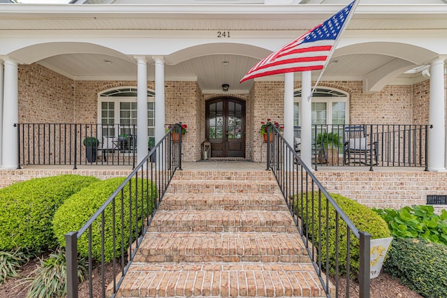241 Clubside Dr, Lexington, SC 29072 - view of exterior entry with french doors, brick siding, and a porch
