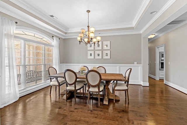 241 Clubside Dr, Lexington, SC 29072 - dining area featuring a tray ceiling, a chandelier, wood finished floors, and crown molding
