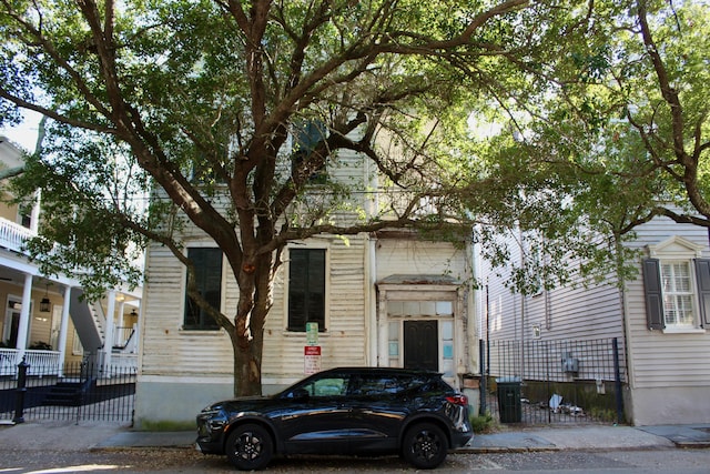 view of front of house with fence