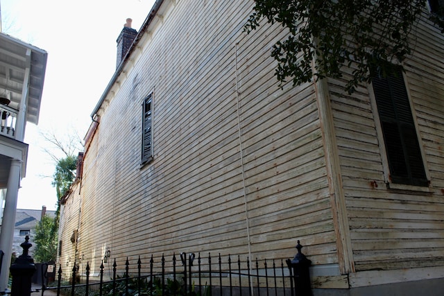 view of property exterior with fence