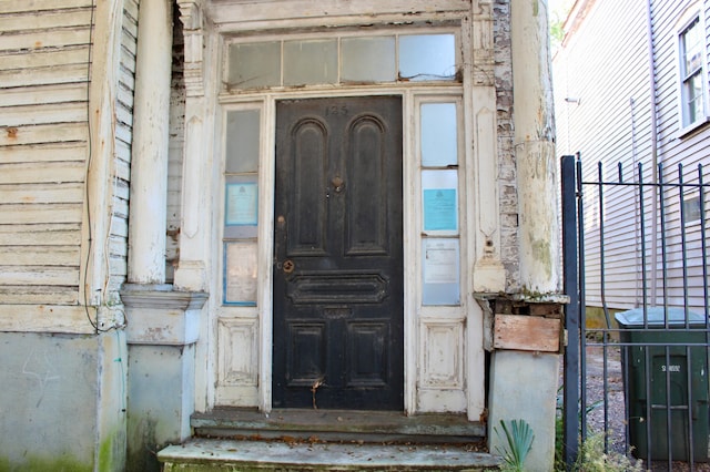 property entrance featuring fence