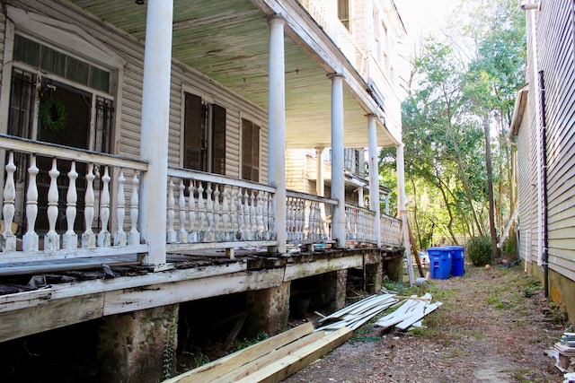 view of side of property with a porch