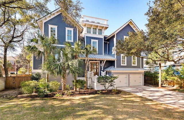 view of front of property with a front yard and a garage