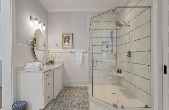 bathroom with vanity and a shower with shower door