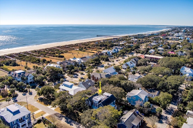 drone / aerial view featuring a water view and a beach view