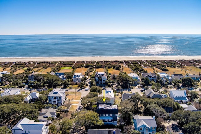 bird's eye view with a water view and a beach view