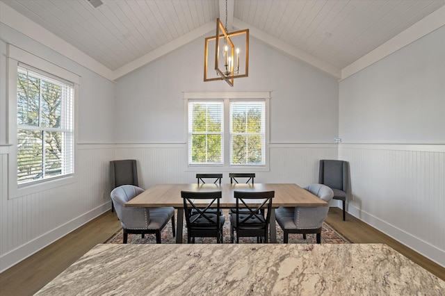 dining space with dark hardwood / wood-style flooring, wood ceiling, vaulted ceiling, and an inviting chandelier