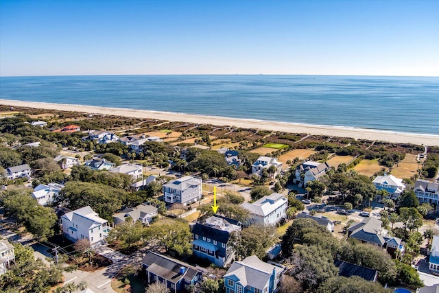 drone / aerial view featuring a water view and a beach view