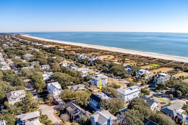 birds eye view of property featuring a water view and a beach view