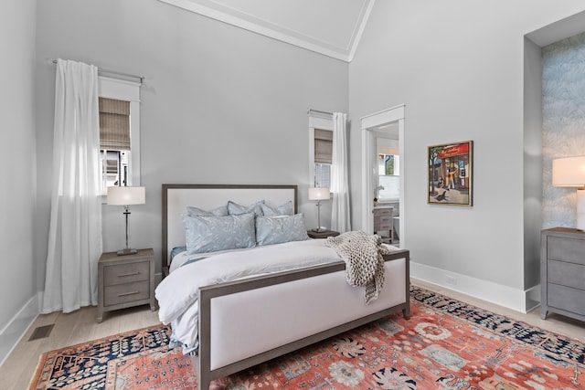 553 Old Compass Rd, Daniel Island, SC 29492 - bedroom featuring multiple windows, wood finished floors, crown molding, baseboards, and high vaulted ceiling