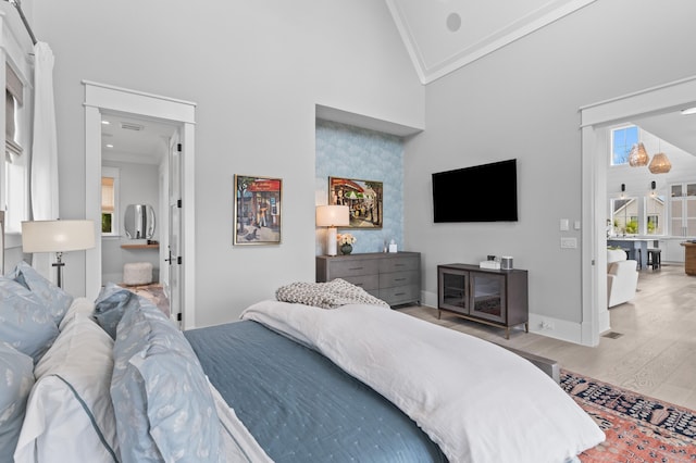 553 Old Compass Rd, Daniel Island, SC 29492 - bedroom featuring crown molding, wood finished floors, high vaulted ceiling, and baseboards