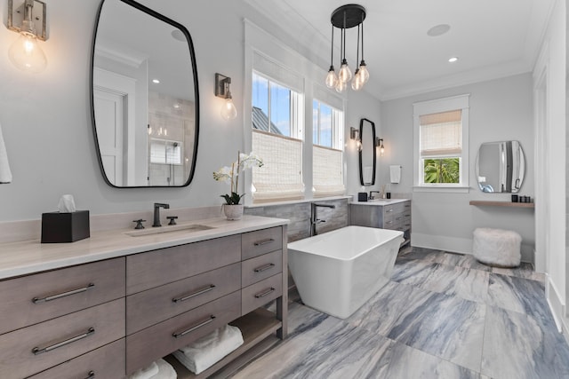 553 Old Compass Rd, Daniel Island, SC 29492 - bathroom featuring crown molding, two vanities, a freestanding tub, marble finish flooring, and baseboards