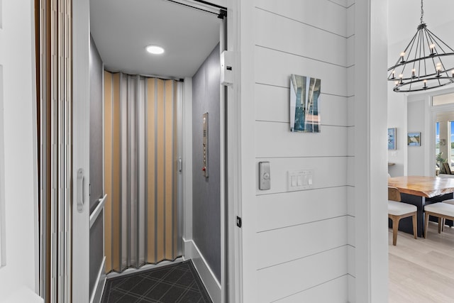 553 Old Compass Rd, Daniel Island, SC 29492 - hallway featuring a chandelier, elevator, and baseboards