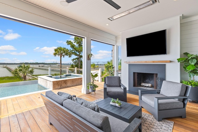 553 Old Compass Rd, Daniel Island, SC 29492 - deck featuring a ceiling fan, an outdoor living space with a fireplace, and an outdoor pool