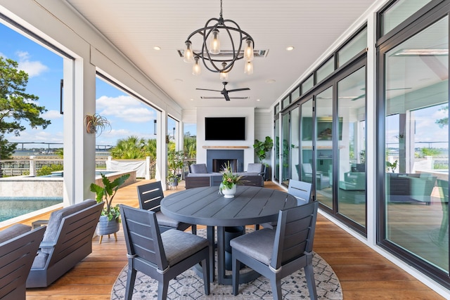 553 Old Compass Rd, Daniel Island, SC 29492 - sunroom / solarium featuring a chandelier and wood finished floors