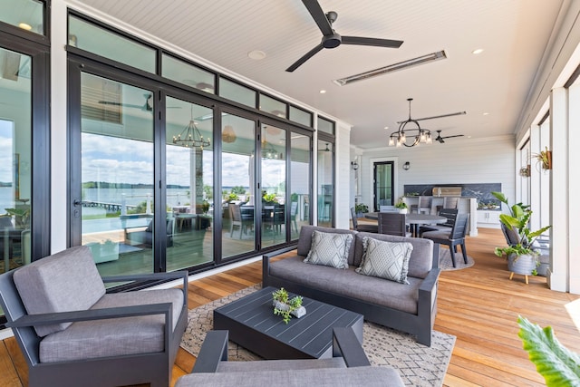 553 Old Compass Rd, Daniel Island, SC 29492 - sunroom / solarium featuring a chandelier