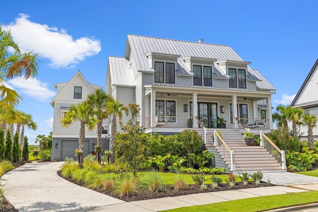 553 Old Compass Rd, Daniel Island, SC 29492 - view of front of home with stairs, a porch, a ceiling fan, a garage, and concrete driveway