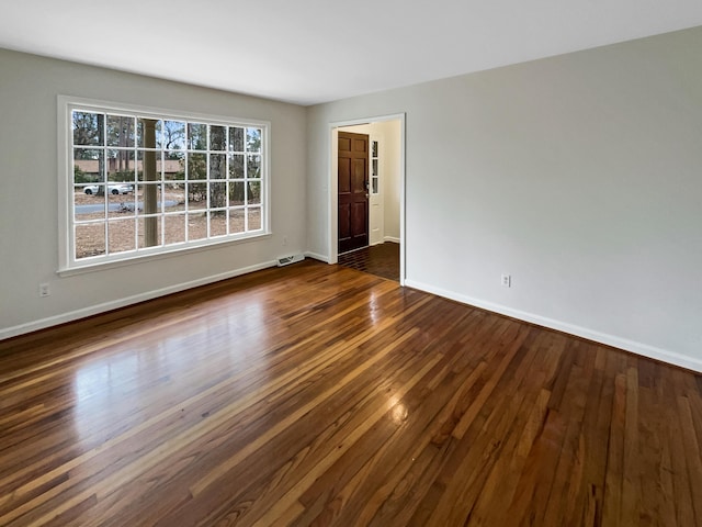 empty room featuring dark hardwood / wood-style floors