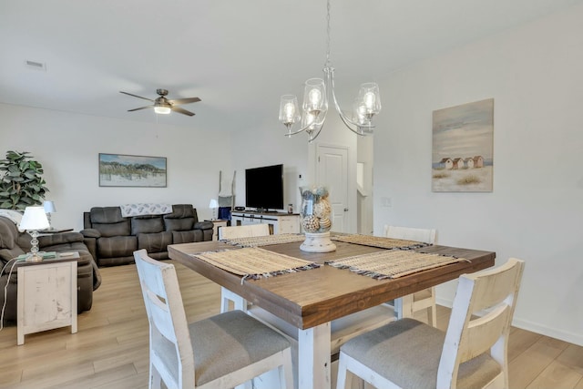 432 Eva St, Moncks Corner, SC 29461 - dining space featuring ceiling fan with notable chandelier and light hardwood / wood-style floors