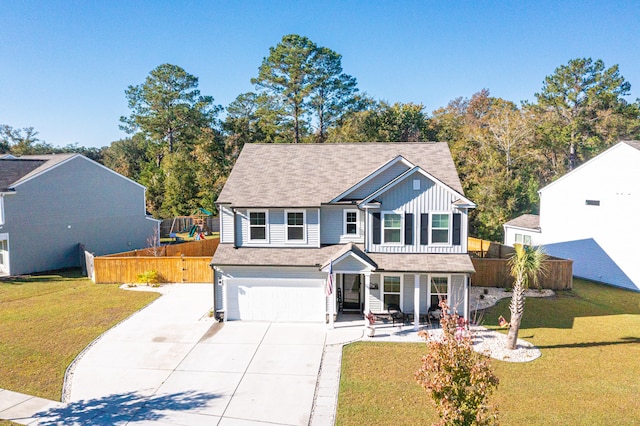 view of front of property featuring a garage and a front lawn